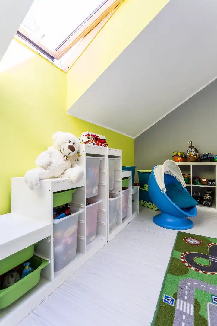 Unisex children’s playroom with toys and storage